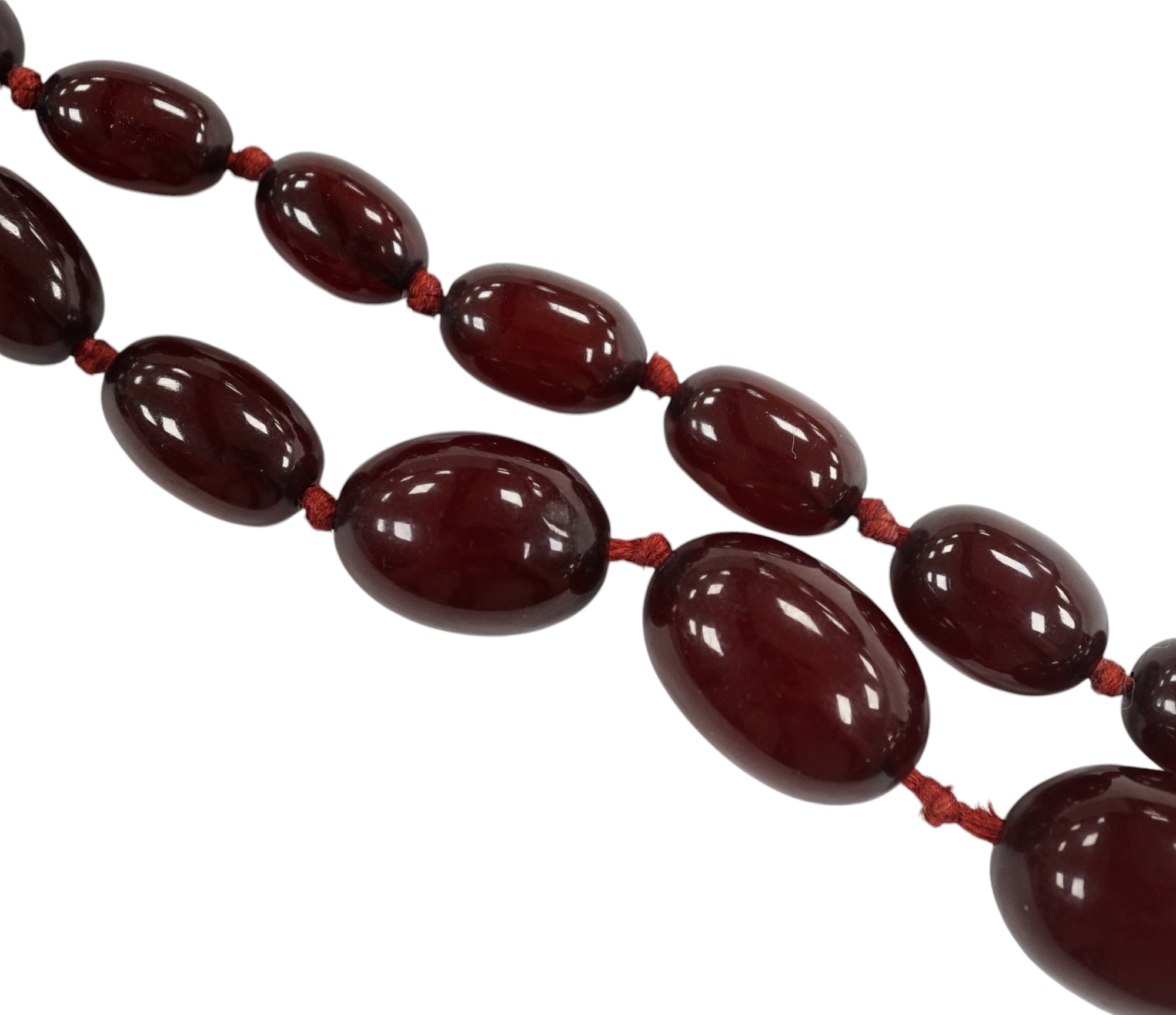 A single strand graduated simulated cherry amber bead necklace, gross weight 66 grams (string a.f.) Condition - poor to fair